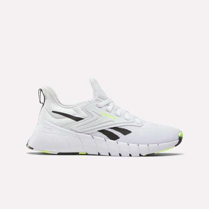 The Reebok Women's Nano Gym Training Shoes feature a chunky sole, black and neon yellow accents, a mesh upper, lace-up closure, and bold black logo—perfect cross-training shoes for weight training. Shown against a white background.