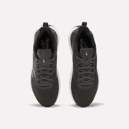 A pair of Reebok Men's Nano Gym Training Shoes in dark gray, shown from above with mesh uppers, black laces, and white soles—perfect for training, displayed on a plain white background.