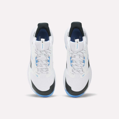The Reebok Nano Golf Shoes are white athletic sneakers with black and blue accents, seen from above on a white background. They feature white laces, a FlexWeave mesh upper for modern style, and enhanced performance foam for comfort.