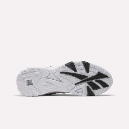 The image shows the bottom view of the Reebok Brutus Low Shoes, featuring a white sole with textured tread patterns and black rubber accents for grip—a street-ready style perfect for everyday wear.