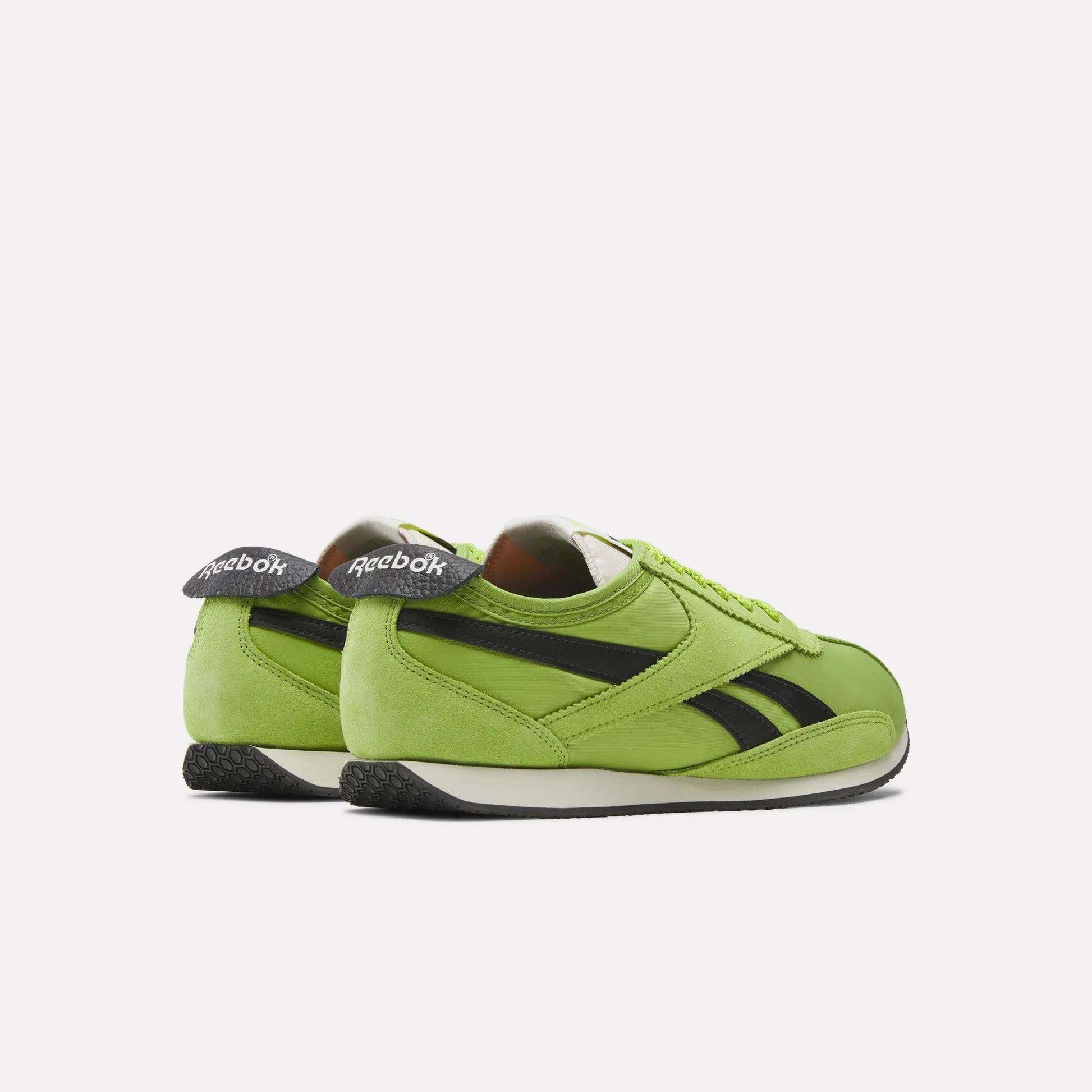 A pair of green Reebok R400 Shoes with black stripes and white soles, shown from the back and side on a plain white background.