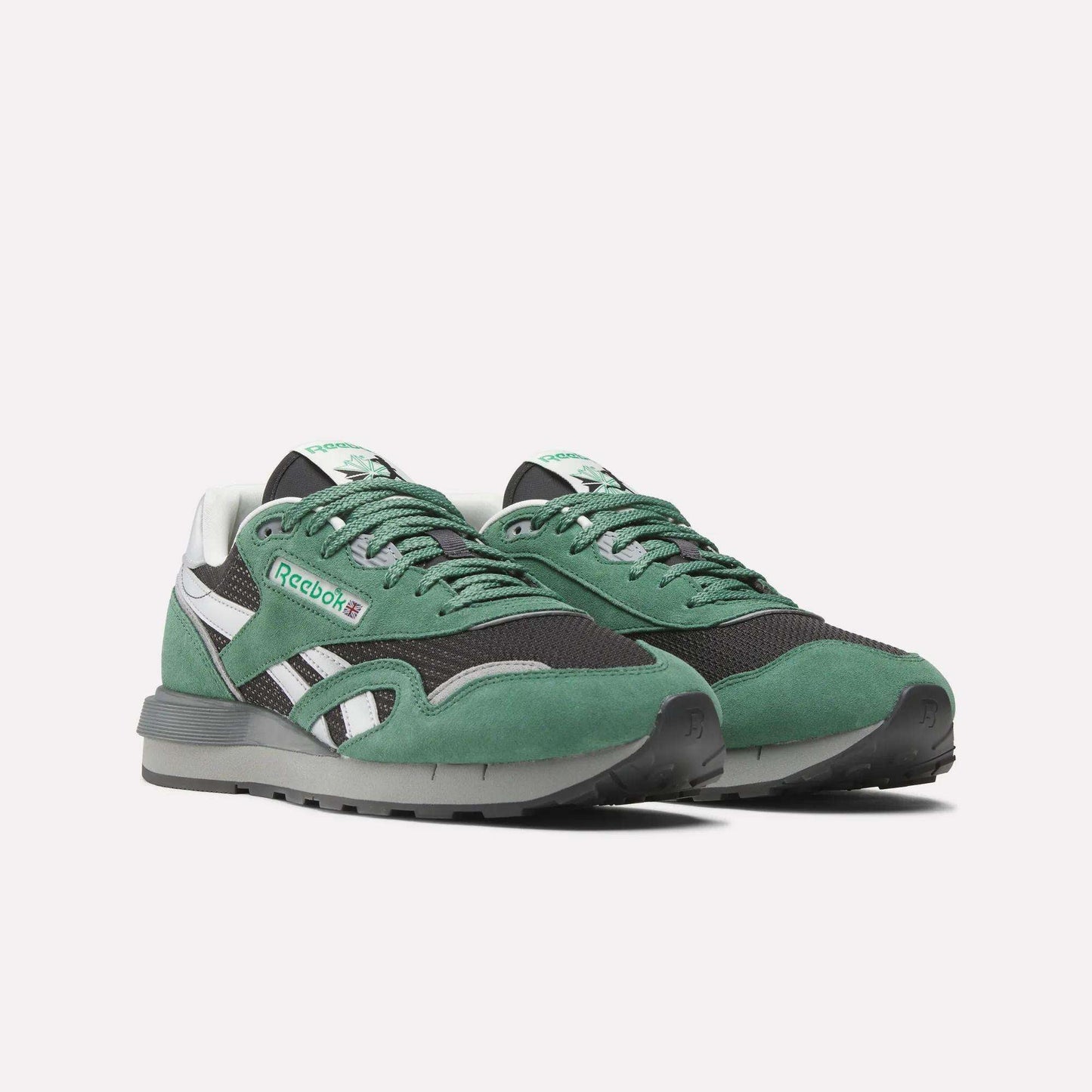 A pair of Reebok Classic Nylon 89 Shoes in green and black with white accents, featuring a lace-up closure, classic design, and the Reebok logo on the side and tongue, shown on a plain white background.