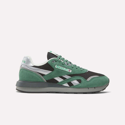 The Reebok Classic Nylon 89 Shoes feature green and black uppers with silver accents, a white midsole, and a dark gray outsole—shown in side profile on a plain white background—ideal for vintage running shoe enthusiasts.
