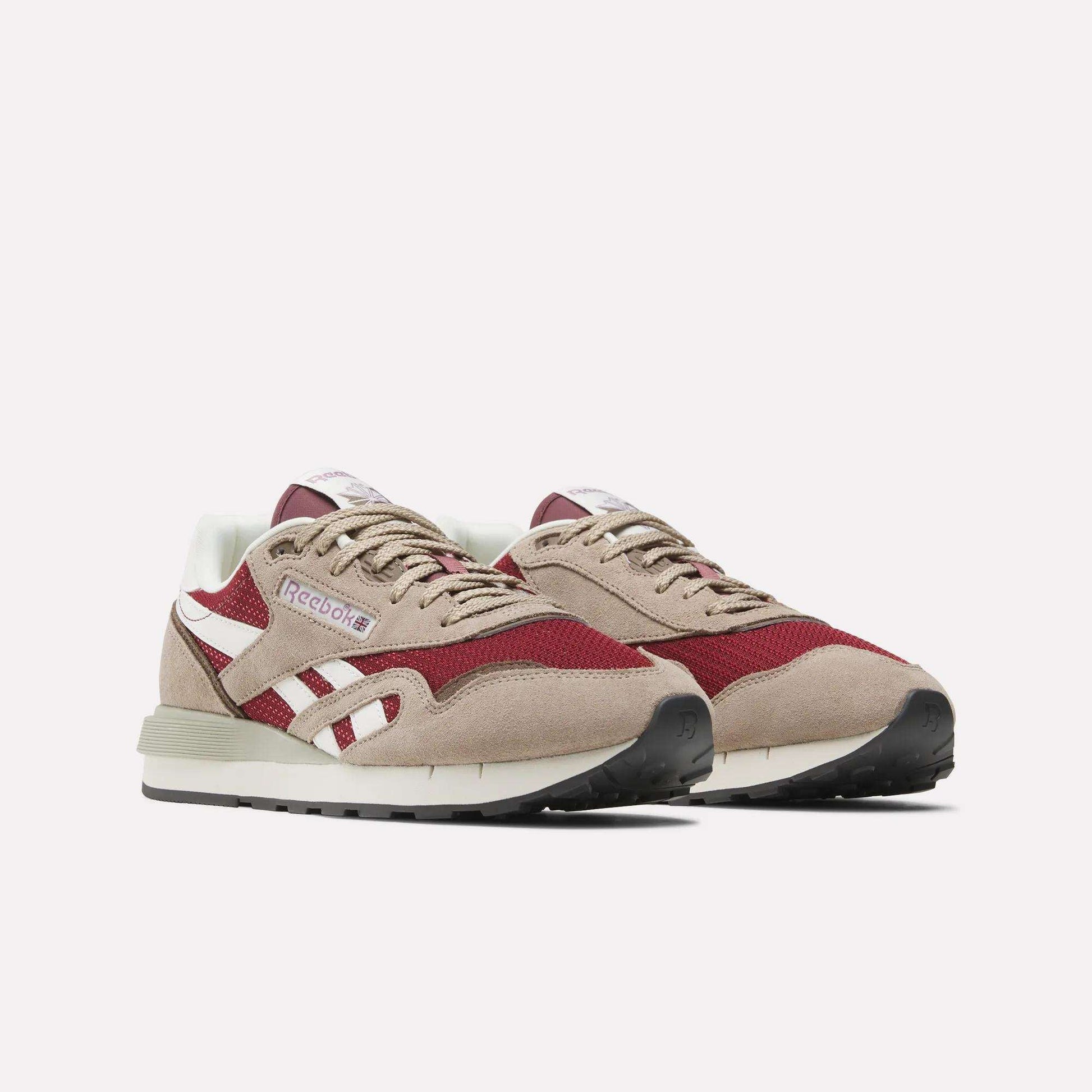The Reebok Classic Nylon 89 Shoes in beige, white, and burgundy feature a suede and mesh upper, cushioned midsole, white side stripes, and black rubber soles, showcased against a plain white background.