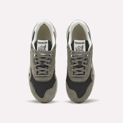 A pair of Reebok Classic Nylon 89 Shoes seen from above, with gray suede overlays, black mesh panels, white midsoles and interiors. Each heritage sneaker displays the Reebok logo on the tongue.