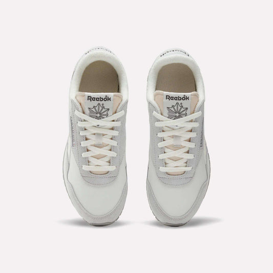 Top view of a pair of Women's Classic AZ Shoes by Reebok in white and light gray with white laces, low-profile design, and the Reebok logo visible on each tongue, displayed side by side on a plain background.