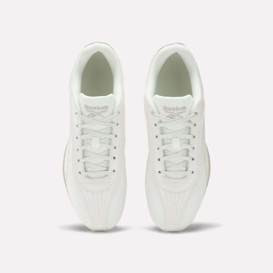 Top view of Women's Ultra Lo Shoes by Reebok in white, featuring white laces and Reebok branding on the tongues. The low-profile, minimalist shoes are placed side by side on a plain white background.