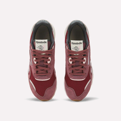 A pair of Women's Classic Nylon 89 Shoes by Reebok in maroon with white accents is shown from above on a plain white background, featuring retro mesh and suede materials and the Reebok logo on the tongue.
