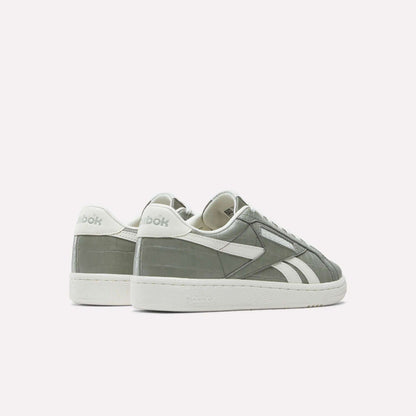 A pair of Reebok Women's Club C Grounds UK Shoes in gray and white premium leather, featuring the brand logo on the heel and side, displayed on a white background with one shoe slightly behind the other.