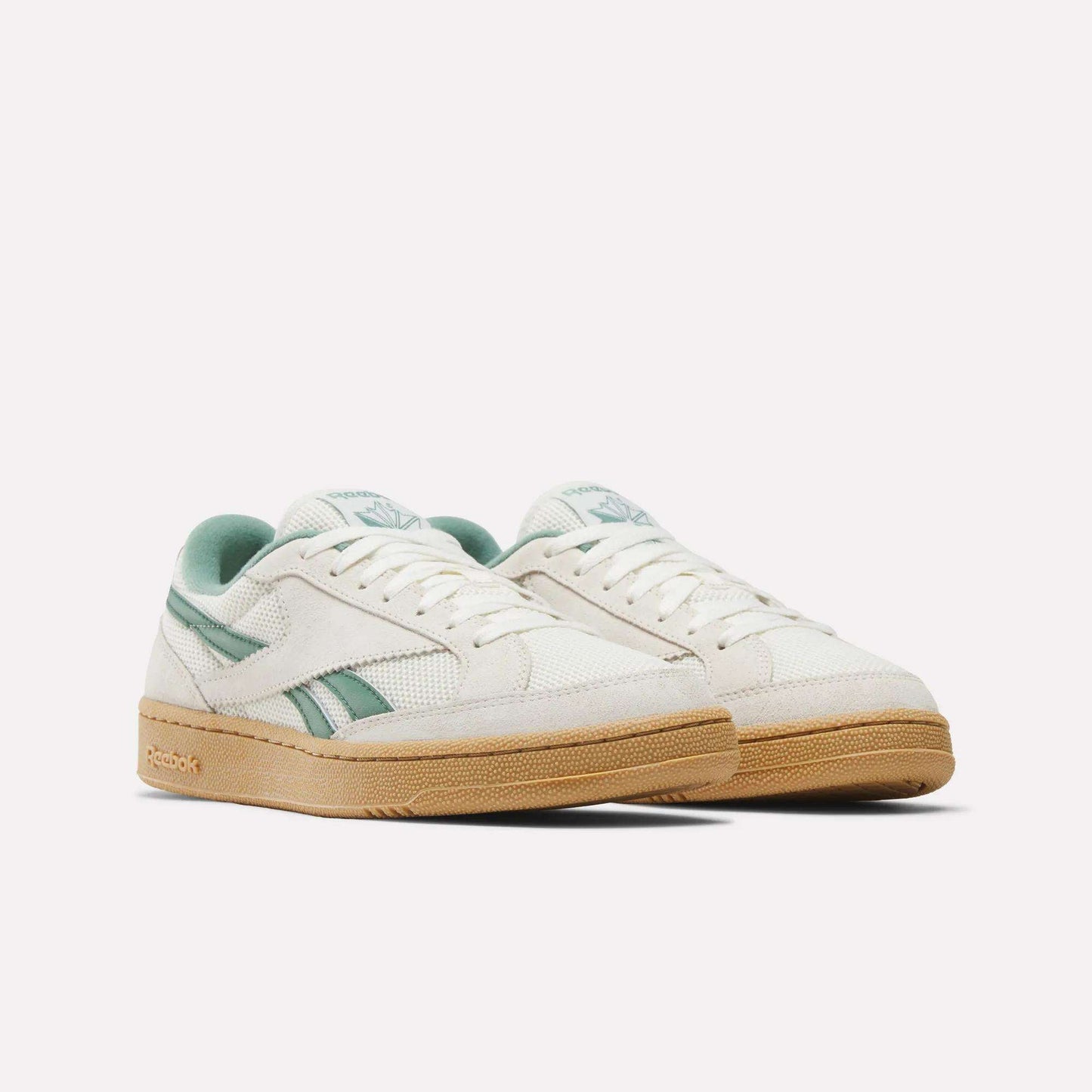 A pair of Reebok Club C Grounds 70 Shoes in off-white with mint green accents and a tan rubber sole, premium suede details, displayed side by side on a plain white background.
