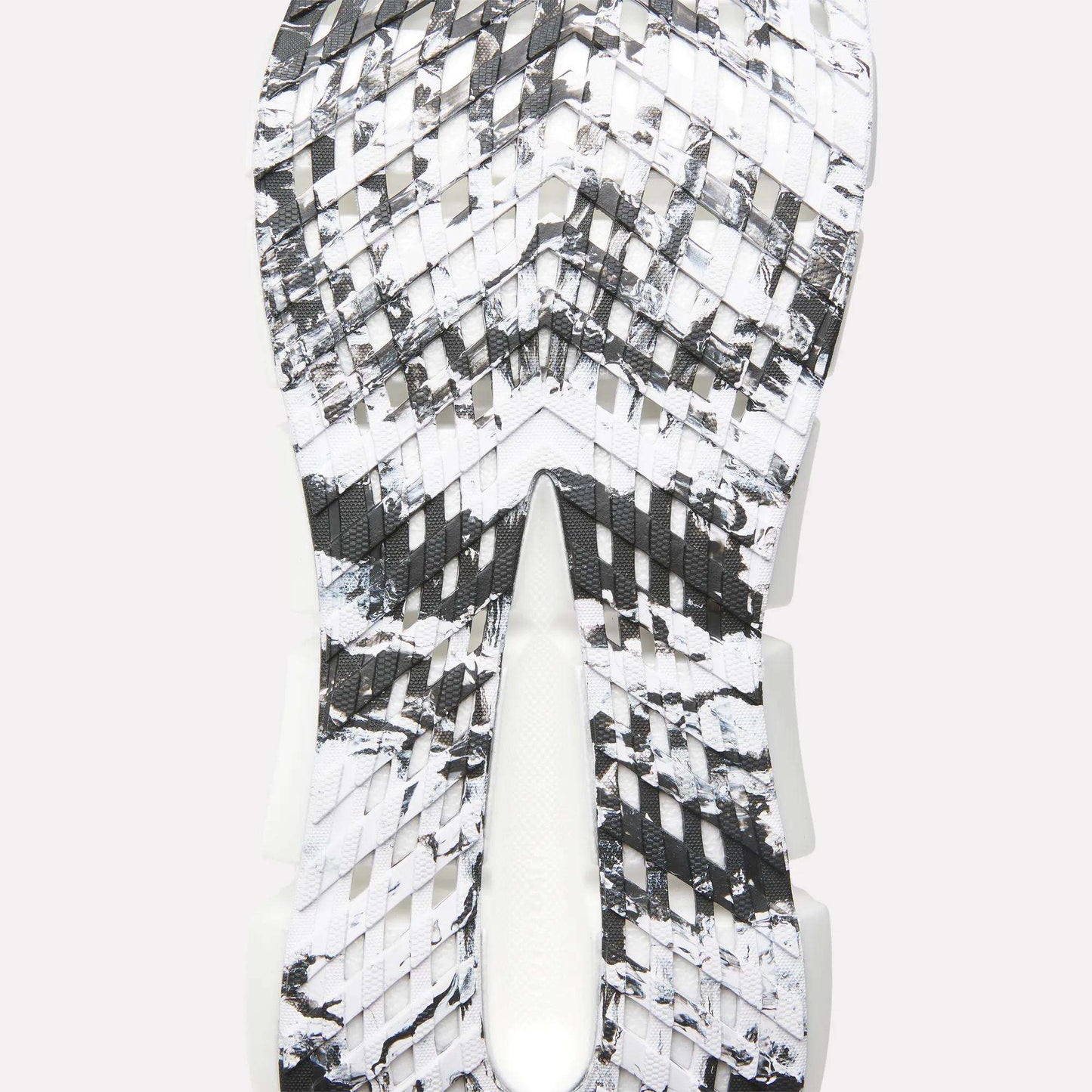Close-up of the Reebok FloatZig 2 Running Shoes sole featuring a black, white, and gray marbled pattern, textured angular grooves for traction, and Superfloat+ cushioning for responsive comfort.