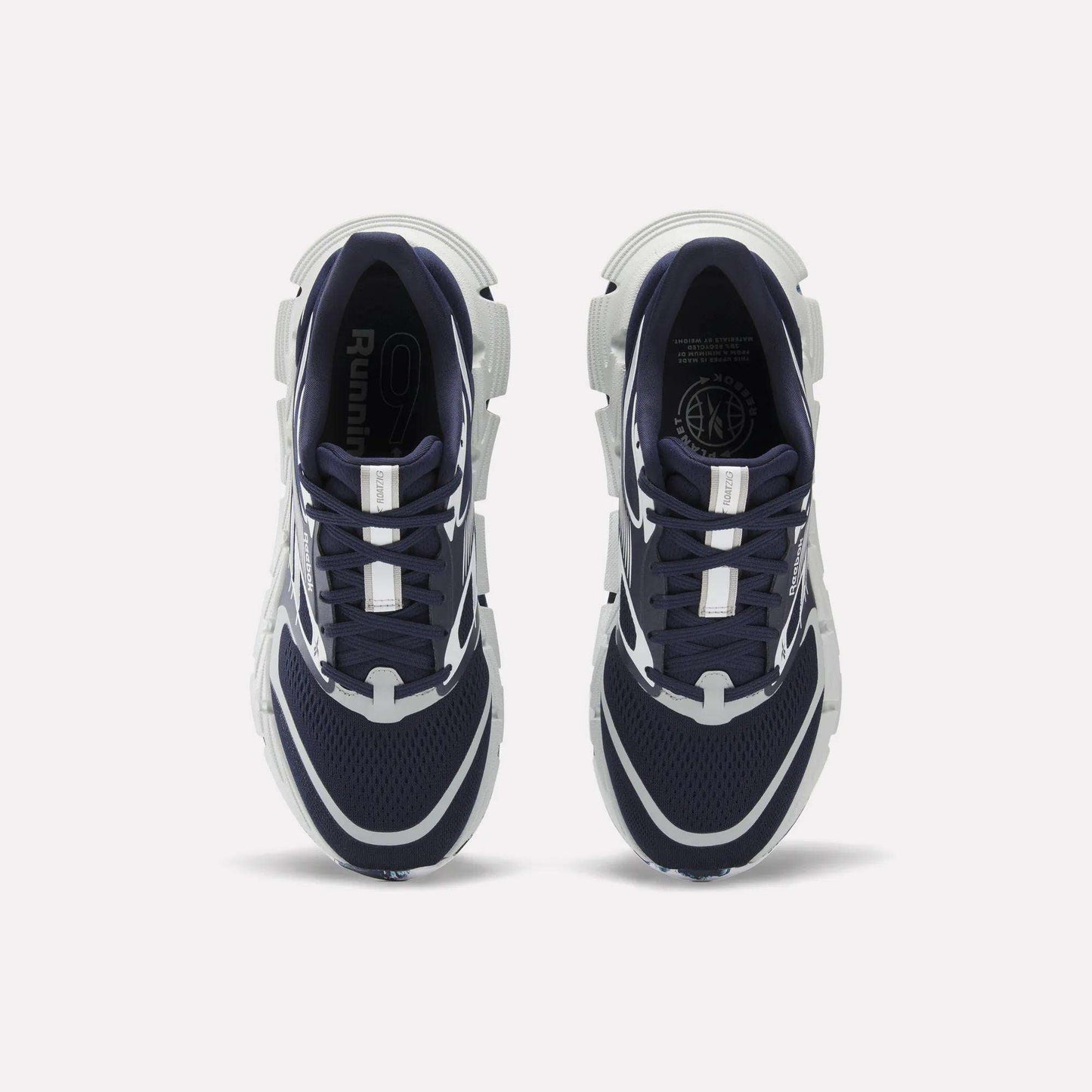 A pair of Reebok FloatZig 2 Running Shoes in navy blue and white are shown from above on a white background. They feature mesh uppers, Superfloat+ cushioning, white accents, and chunky white soles.