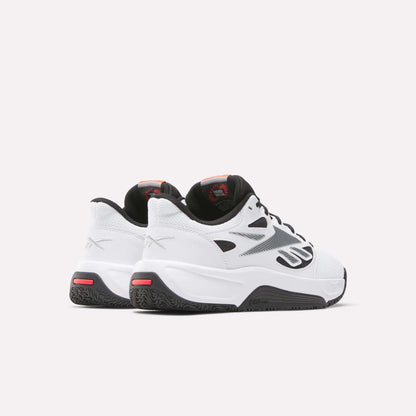A pair of Reebok Engine LT Shoes in white with black soles, black and silver details, and red accents are positioned side by side on a plain light background, facing away and slightly to the right.