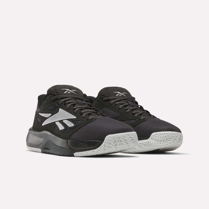 A pair of Reebok Engine LT Shoes with black mesh uppers, white textured soles, and bold white Reebok logos on the sides, shown on a plain light background.