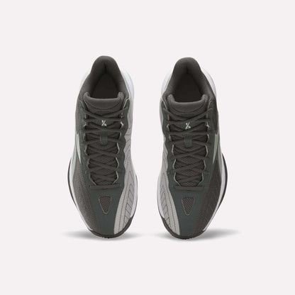 A pair of Reebok Press Basketball Shoes in dark gray and light gray are shown from above, highlighting their laces and classic basketball style against a plain white background.