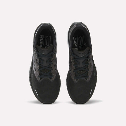 Top view of Reebok Men's FloatZig Tread Running Shoes in black with cushioned midsoles and grey accents, side by side on a white background. Insoles display “Run” and “XOL” in white—ideal for treadmill sessions.