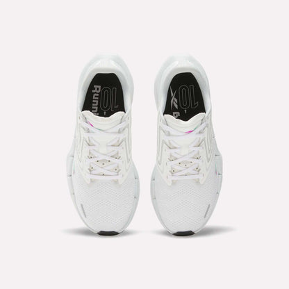 Top view of Reebok Women's FloatZig Tread Running Shoes featuring breathable mesh uppers, black soles, patterned laces, and a subtle zigzag design on a plain white background.