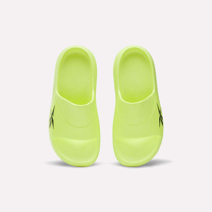 A pair of neon yellow Reebok DMX Recovery Walking Slides with textured footbeds, moving air cushioning, and a black logo on the side, shown from above on a white background.
