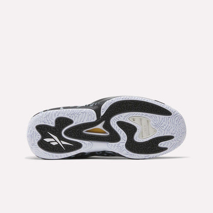 The image shows the sole of the Reebok Engine A 26 Basketball Shoes, with a wavy black and white pattern, textured grip, and a gold accent near the midfoot. The Reebok logo highlights their lightweight support for peak performance.
