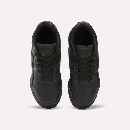 A pair of Reebok Workout Plus Shoes for little kids in black, shown from above on a white background, highlighting the laces, stitched details, and Reebok logos on the tongues.
