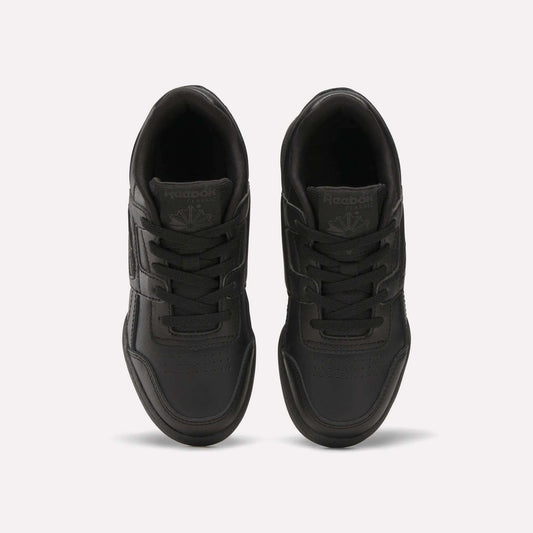 A pair of Reebok Workout Plus Shoes for little kids in black, shown from above on a white background, highlighting the laces, stitched details, and Reebok logos on the tongues.