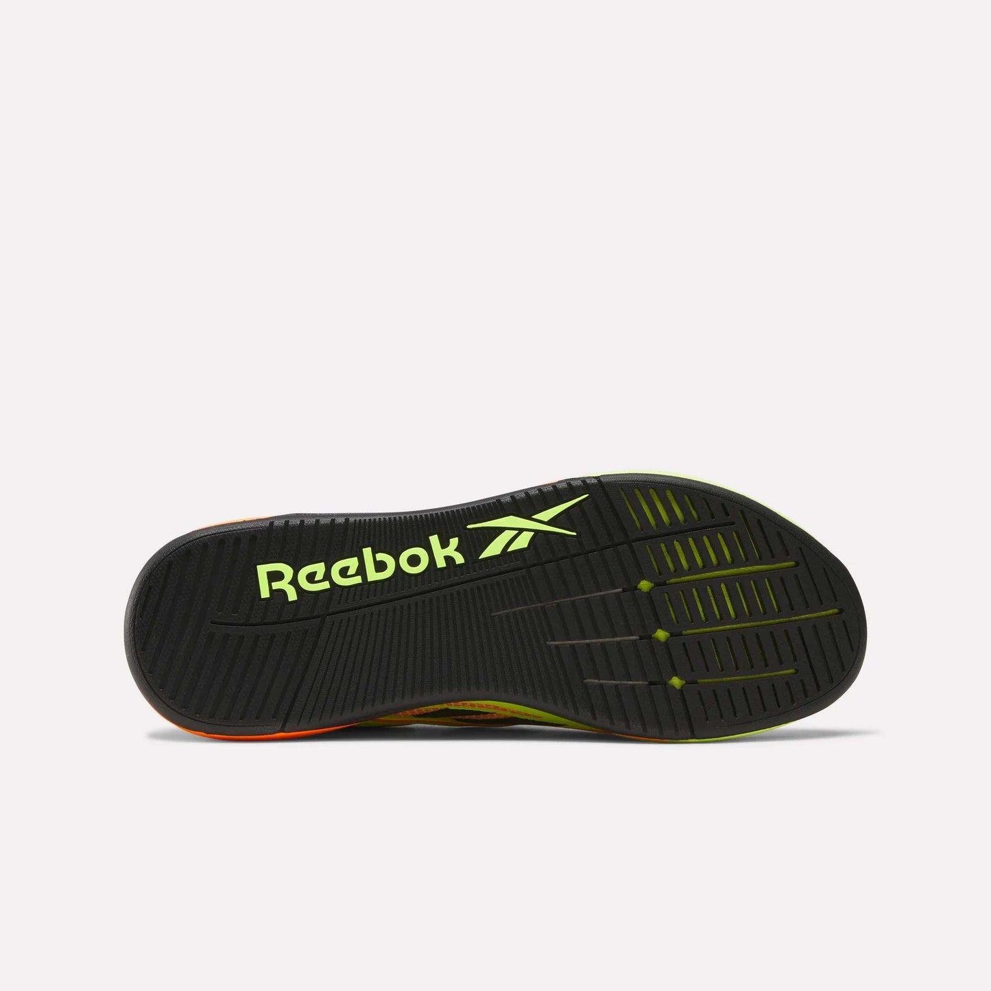 The image displays the sole of Reebok Nano X5 Edge Training Shoes featuring a black base with yellow-green accents, a bold yellow-green Reebok logo, and a durable tread pattern with Flexweave for enhanced grip.