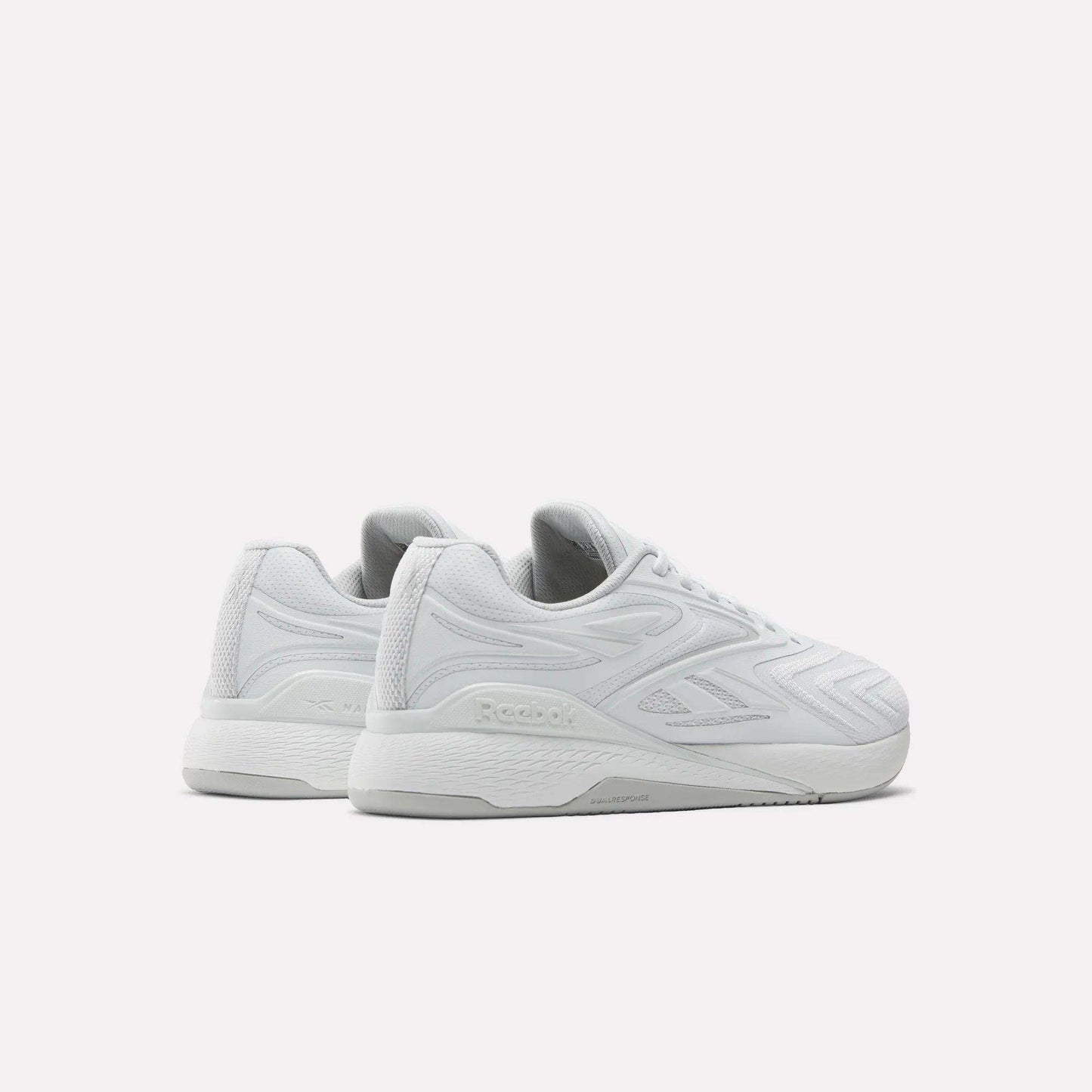 A pair of white Reebok Nano X5 Edge Training Shoes with textured side panels and a chunky sole, designed for precision training, are positioned side by side facing left on a plain white background.