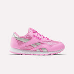 The Reebok x Paw Patrol Classic Nylon Shoes for little kids feature a pink design with silver accents, pink laces, and a white sole—ideal for stylish comfort—shown against a simple white background.