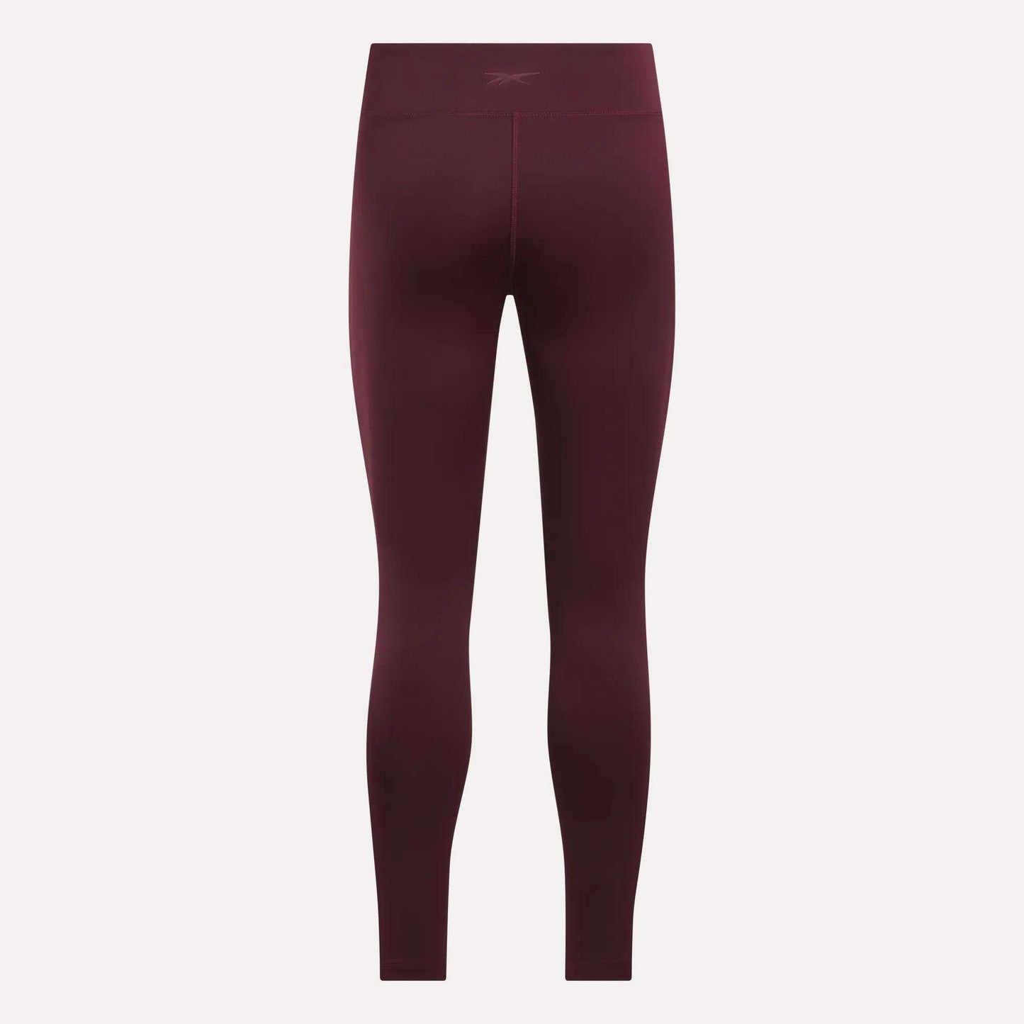 Women's Lux High-Rise Tights by Reebok shown from the back against a light background, with a subtle waistband logo and seamless RBK-DRY fabric for performance.