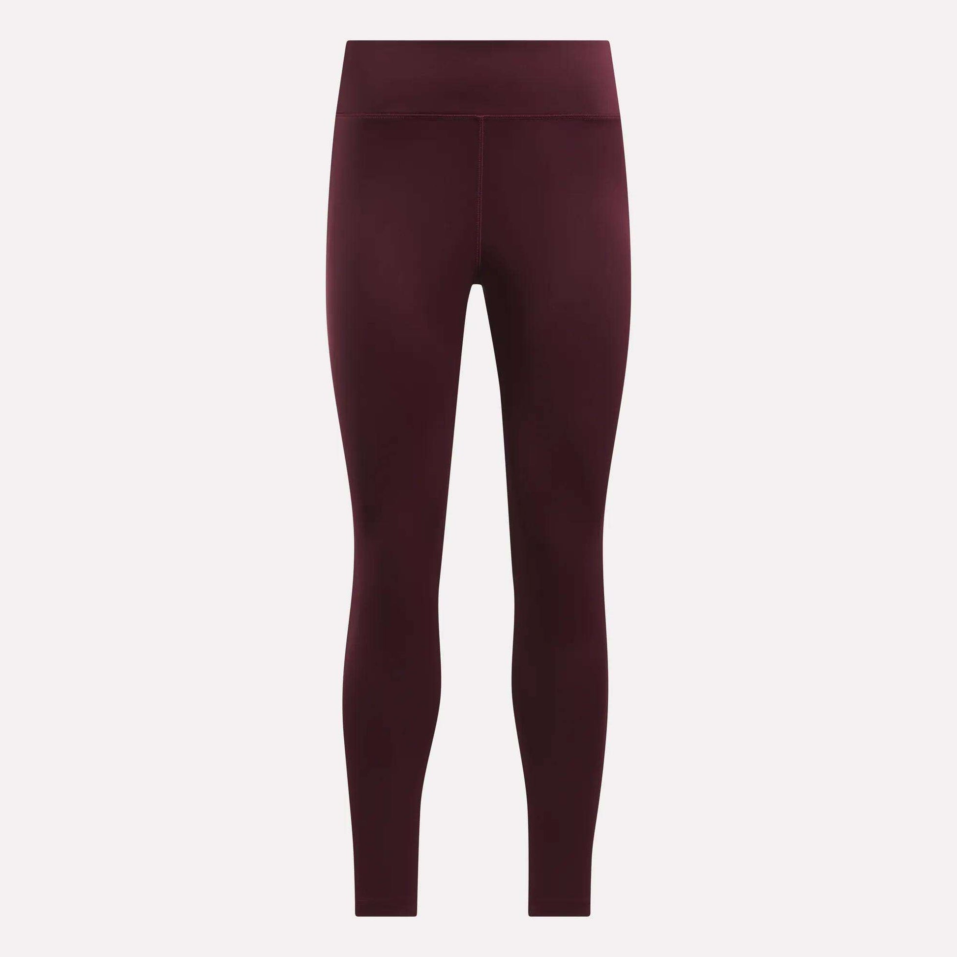 A pair of maroon Women's Lux High-Rise Tights by Reebok, made with RBK-DRY performance fabric.