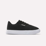 The Reebok Women's OnLux Court Lite Walking Shoes feature a black design with black laces and a white rubber sole, displayed in side profile on a light background—ideal for comfortable all-day walking.