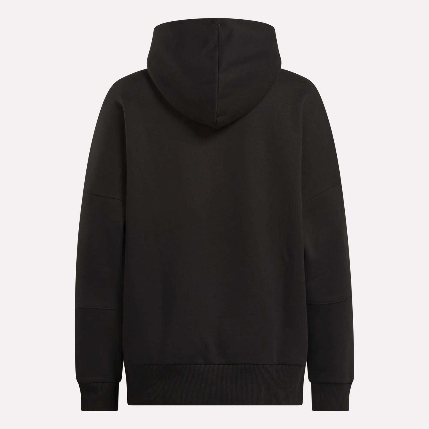 The Reebok Women's Lux Hoodie is shown from the back in plain black, with an oversized fit, long sleeves, and the hood up. It has no visible logos or patterns—ideal for a relaxed, cozy look.