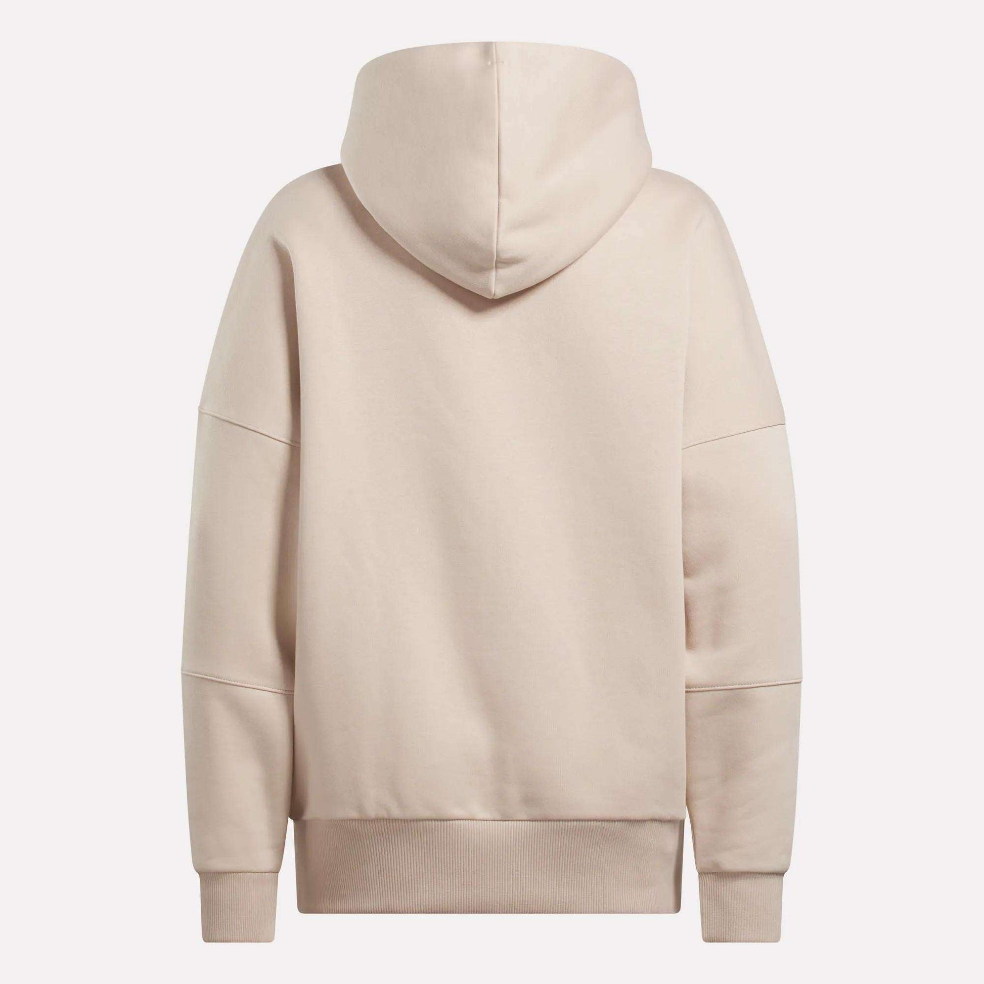 The Reebok Women's Lux Hoodie in beige features an oversized fit, long sleeves, large hood, and ribbed cuffs and waistband, shown from the back against a plain white background.