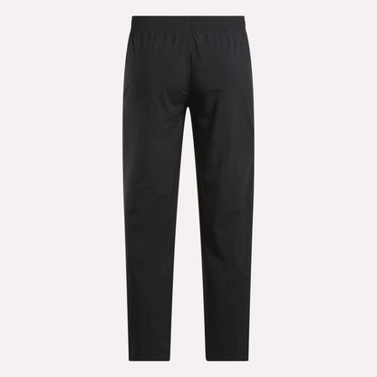 The Reebok Men's Train Woven Unlined Pants in black are lightweight workout pants, ideal for gym training, shown on a white background.