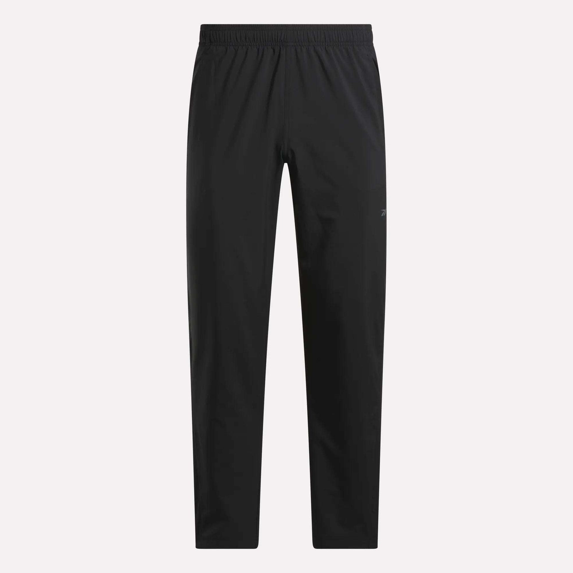 The Reebok Men's Train Woven Unlined Pants feature a black design with an elastic waistband and straight legs. Lightweight and pocketless, they're ideal for gym or daily wear, shown here on a plain white background.