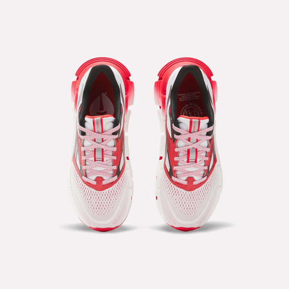 The Reebok Women's FloatZig 2 AHA Running Shoes feature a white mesh upper, red and black accents, white laces, and energy-returning cushioning for comfort and performance. Shown from above.