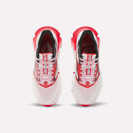 The Reebok Women's FloatZig 2 AHA Running Shoes feature a white mesh upper, red and black accents, white laces, and energy-returning cushioning for comfort and performance. Shown from above.