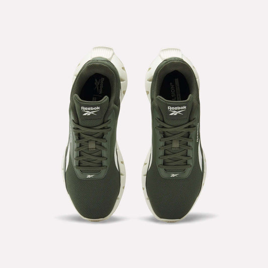 Top view of a pair of Reebok Zig Dynamica STR Shoes in olive green with white soles, featuring breathable mesh uppers, positioned side by side on a plain light background.