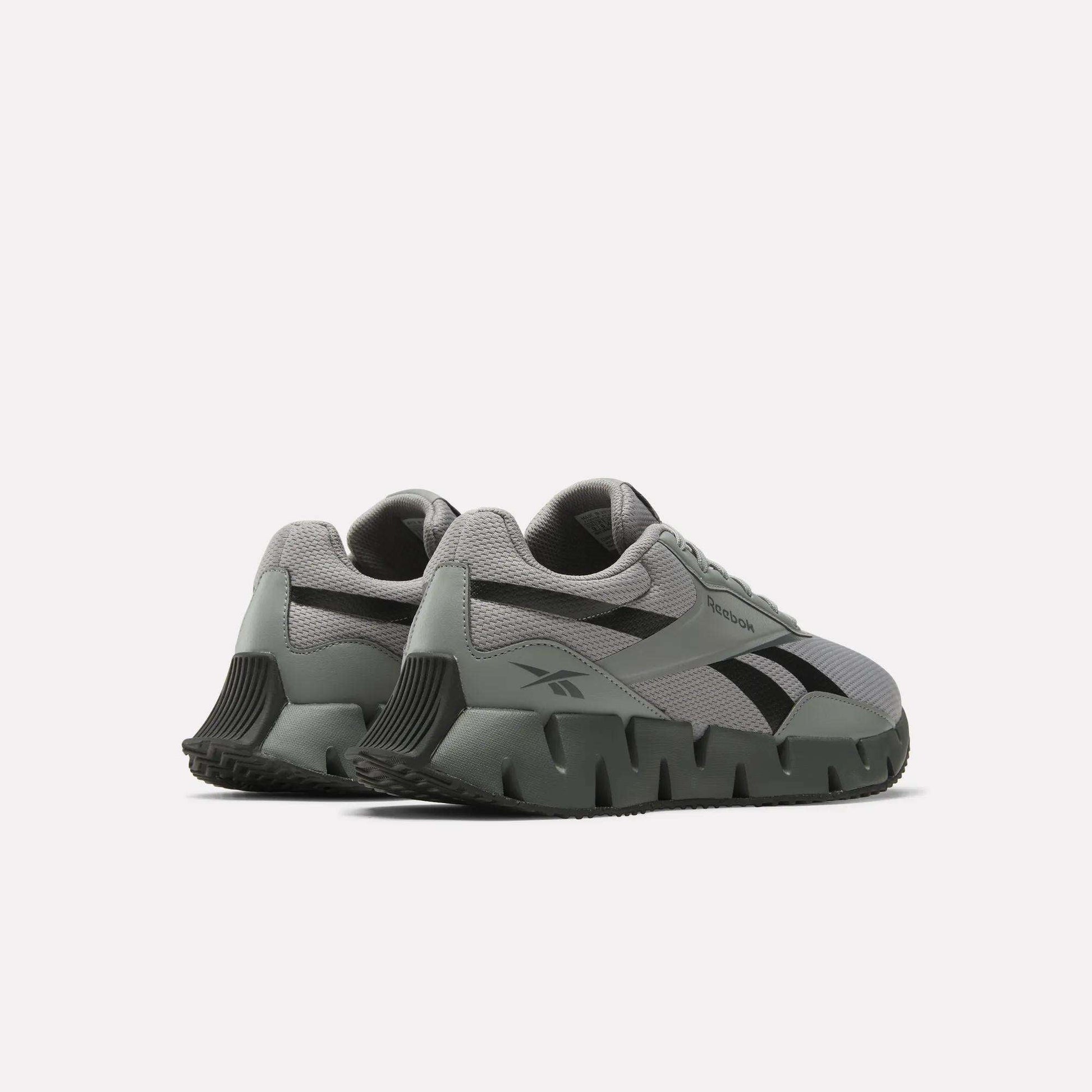 The Reebok Zig Dynamica STR Shoes are gray running sneakers with chunky, sculpted soles, black accents, and EVA cushioning, shown from a rear side angle on a plain white background.