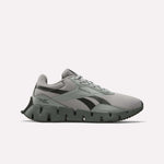 The Reebok Zig Dynamica STR Shoes feature a gray and black mesh upper, EVA cushioning for comfort, a distinctive segmented sole, black side logo, and lace-up closure, shown on a plain white background.