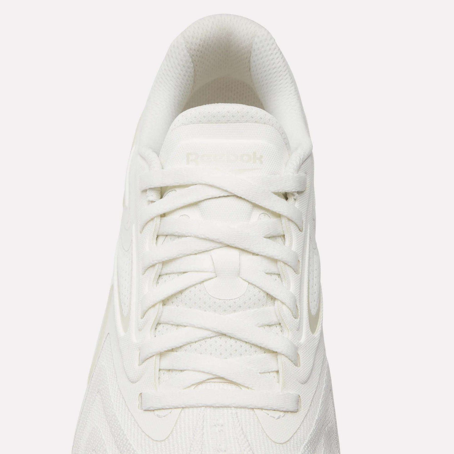 Top view of the Reebok Nano X5 Edge Training Shoes in white with white laces, a textured upper, and a subtle Reebok logo on the tongue—engineered for performance-driven training sessions.