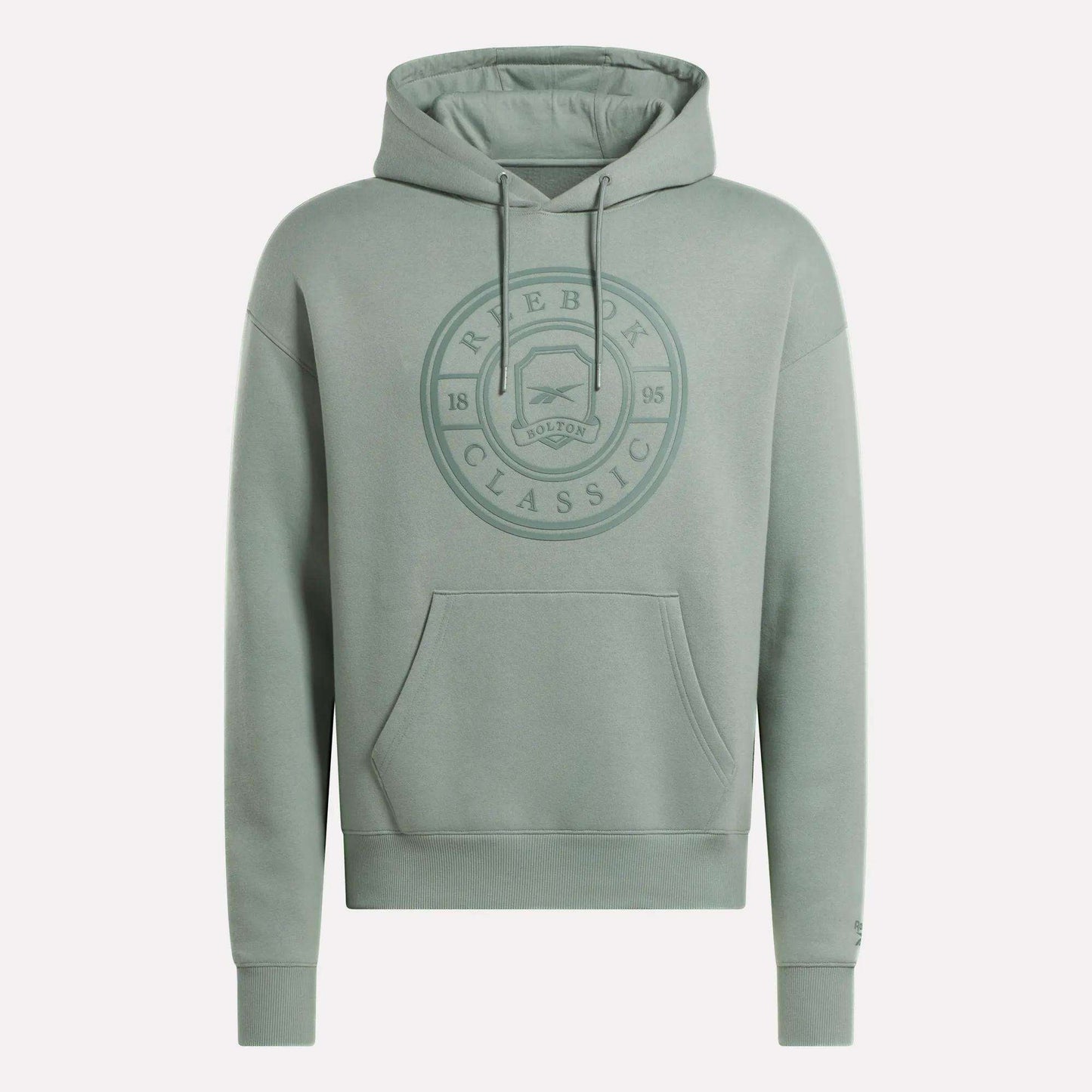 The Men's Crest Hoodie by Reebok is a light green soft fleece hoodie with a relaxed fit, front pocket, drawstring hood, and an embossed circular chest logo reading "Reebok Classic 1895 Bolton." Finished with long sleeves.