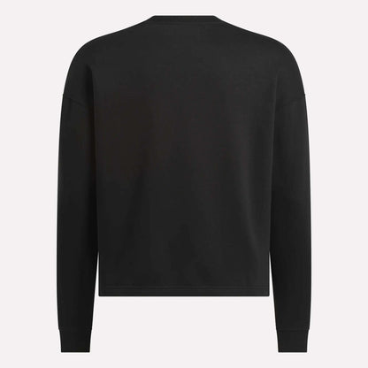 The Men's Wardrobe Essentials Sweatshirt by Reebok is shown from the back in black. This relaxed-fit, crew-neck style is made from soft cotton-blend fleece, with no visible logos, patterns, or fastenings.