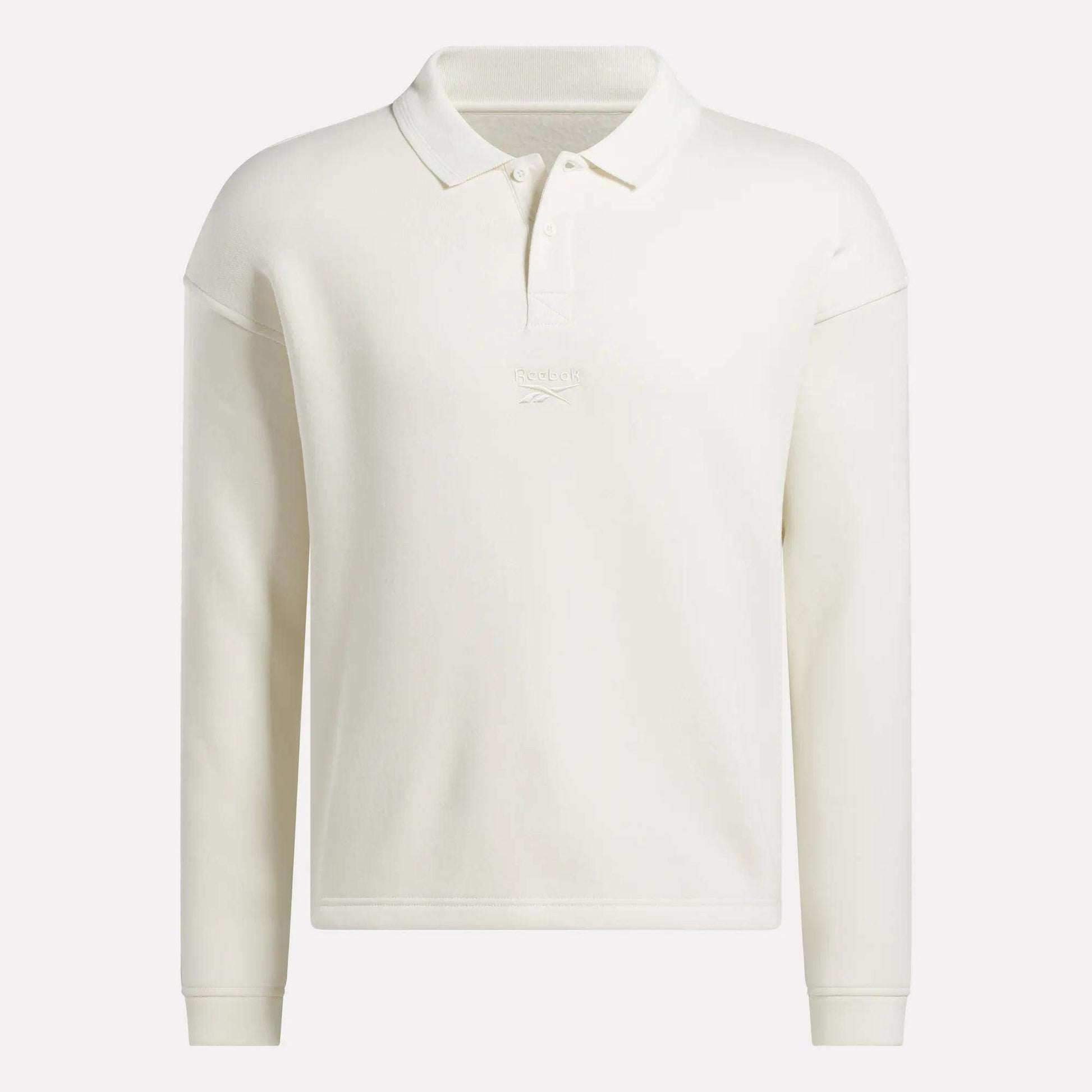 The Men's Wardrobe Essentials Long Sleeve Polo Shirt by Reebok features a collar, button placket, and subtle chest embroidery. Made from a cotton blend, this off-white polo offers a classic, simple look.
