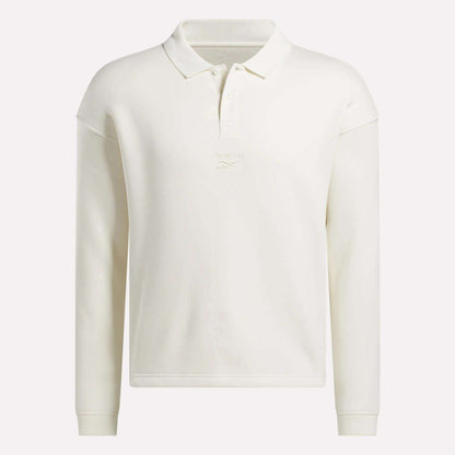 The Men's Wardrobe Essentials Long Sleeve Polo Shirt by Reebok features a collar, button placket, and subtle chest embroidery. Made from a cotton blend, this off-white polo offers a classic, simple look.