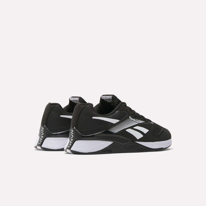 A pair of Reebok Nano X4 Training Shoes with black Flexweave uppers, white soles, and logo accents are positioned side by side at an angle on a plain white background.