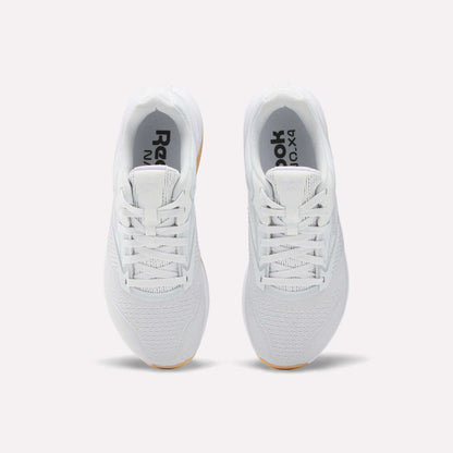 A top view of Reebok Women's Nano X4 Training Shoes in white with light brown soles, featuring a breathable design and Floatride Energy Foam, shown side by side on a plain white background.