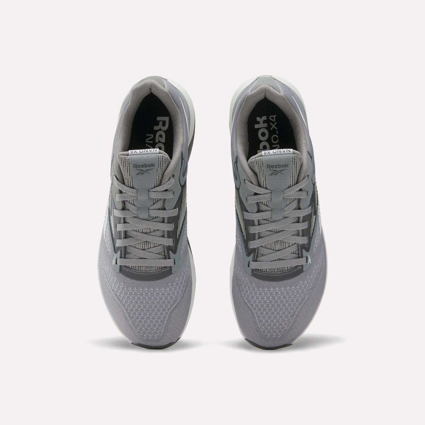 A pair of gray Reebok Nano X4 Training Shoes seen from above, showing the laces, mesh texture, and Reebok branding on the tongue and insole, featuring Floatride Energy Foam for enhanced comfort.