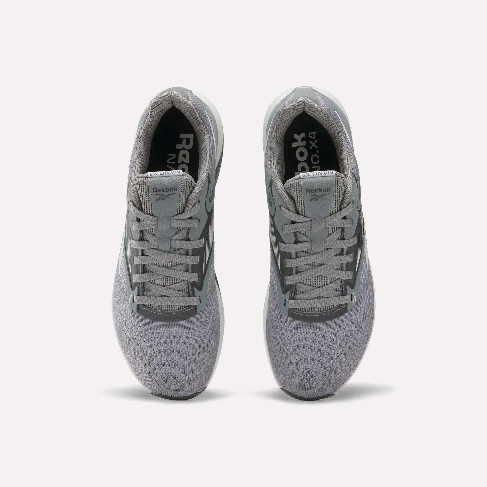 A pair of gray Reebok Nano X4 Training Shoes seen from above, showing the laces, mesh texture, and Reebok branding on the tongue and insole, featuring Floatride Energy Foam for enhanced comfort.