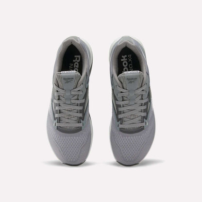 A pair of gray Reebok Nano X4 Training Shoes seen from above, showing the laces, mesh texture, and Reebok branding on the tongue and insole, featuring Floatride Energy Foam for enhanced comfort.